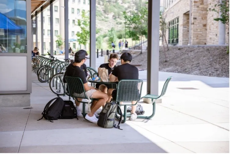 Students sitting at a table outside of Alpine Express